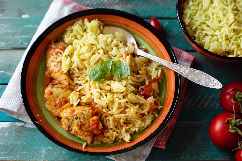 Close-up of Sindhi Biryani Recipe showing vibrant rice, tender chicken pieces, and potatoes